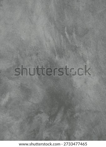Background; This image showcase the texture of a Polish concrete or cement wash surface with a minimalist industrial feel. It features a blend of gray gradients forming natural mottle patterns and subtle streak, creating an artistic yet masculine impression.