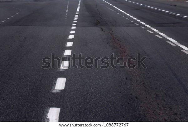 Background with\
tire marks on road closeup\
photo