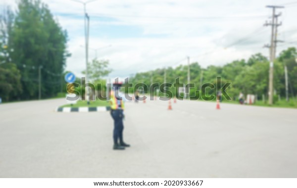 background of\
traffic officers working in blurry\
road