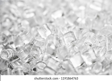 Background of transparent plastic granules. Abstract background of artificial diamonds.