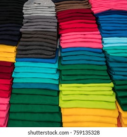 Background of T-shirt folding for sale in the market.