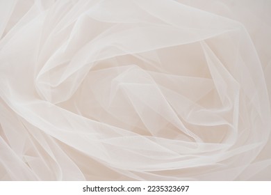 Background of tulle. Beige fabric.   Wedding concept. Sewing industry. selective focus - Powered by Shutterstock