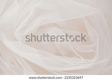 Background of tulle. Beige fabric.   Wedding concept. Sewing industry. selective focus
