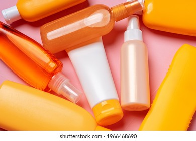 Background of variety of suntan skincare product bottles