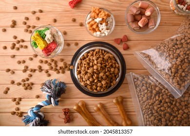 Background with various types of dry food for feeding the dog. Top view. Horizontal composition. - Shutterstock ID 2045813357