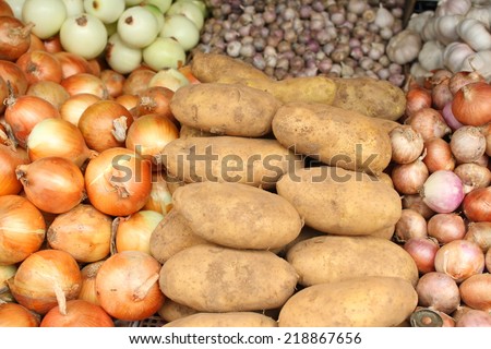 background of vegetable in local grocery in local marker, potato, onion,peeled-onion