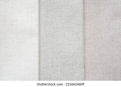 Background from vertical elements. set of beige fabrics in different shades. Homogeneous texture of materials.	
