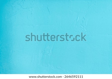 The background of the wall is light blue and textured.