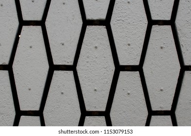 background wall of stones of hexagonal shape