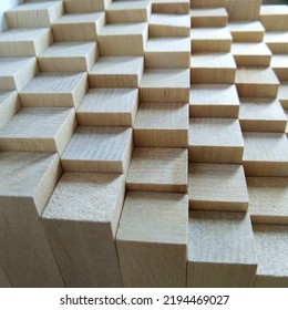 Background Or Wall Of Wooden Blocks Of The Same Size. The Perspective In The Photo Goes Into The Distance. Natural Wood And Environmental Material Background