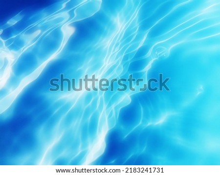 The​ metal​ texture​ of​ surface​ blue​ water​ reflected​ by​ sunlight​ for​ background. Blue​ water​ texture​ in​ the deep​ sea​ for​ background. Reflection​ on​ surface​ blue​ water. Blue​ water.