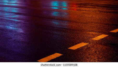 Background of wet asphalt with neon light. Blurred background, night lights, reflection. - Powered by Shutterstock