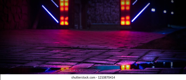 Background Of Wet Asphalt With Neon Light. Blurred Background, Night Lights Of A Big City, Reflection, Puddles. Dark Neon Bokeh.