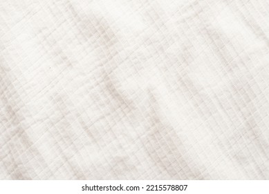 Background Of White Linen Fabric. Texture Of White Material With Folds