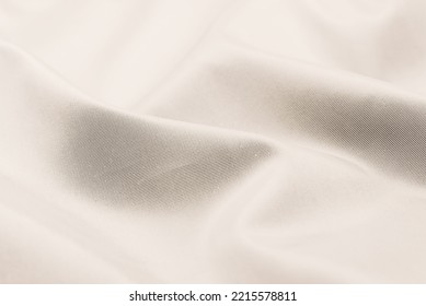 Background Of White Linen Fabric. Texture Of White Material With Folds