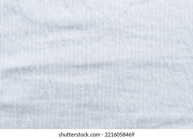 Background Of White Linen Fabric. Texture Of White Material With Folds