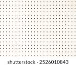 Background of white peg board with holes