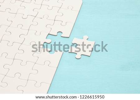 background of white puzzle with missing piece