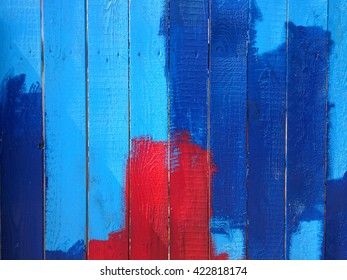 Background Of A Wooden Fence Colored With Red And Blue Paint