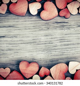background with wooden  hearts, place for text - Shutterstock ID 340131782