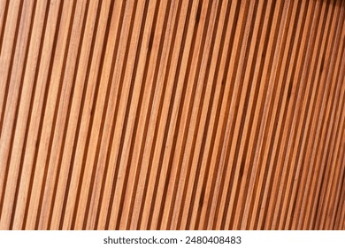 Background of wooden slats with diagonal overlapping boards on brown wall - Powered by Shutterstock