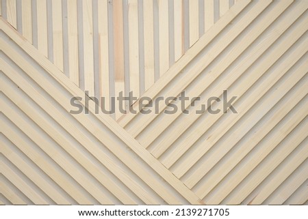 Background of wooden slats. Natural wooden plank on the wall diagonally. texture for background