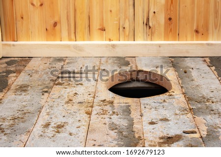 Background of a wooden street toilet , closeup