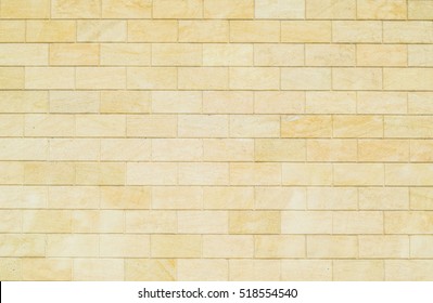 Background Of Yellow Bricks. Wall Of Yellow Bricks. The Texture Of The Wall