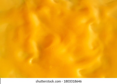 Background Of Yellow Cream Texture. Berry Fruit Yogurt Or Whipped Cream. Smooth Surface Of Body Lacquer Cream. Gold Slime.