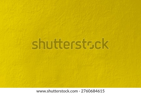 Background of yellow painted wall texture.summer wallpaper bg. yellow wall accent wall for home interior design.Textured colored wall with soft details and texture. Color texture for background backdrop