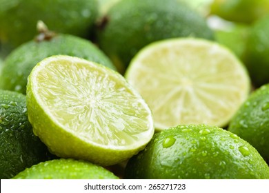 Backgrounds. Close up shot of wet  limes. Focus on the central part of sliced lime. - Powered by Shutterstock