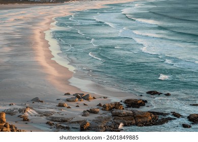 Backgrounds, patterns and Textures of beautiful breaking waves in the  late afternoon golden sun