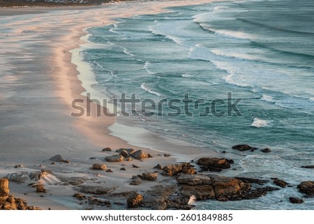 Backgrounds, patterns and Textures of beautiful breaking waves in the  late afternoon golden sun
