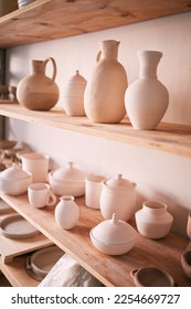 Backgrounds, shelf and pottery in creative workshop, store and manufacturing startup. Ceramics, collection and display in studio, small business and retail craft market, shop and stock production