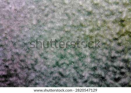 Backgrounds and Textures. Soap and Water splash and spread upon a glass window. Water on glass. Wet Background. Liquid Dreams. Water washes away dirt. Car Wash. Wet Window. Bubble Bath. Water on glass.
