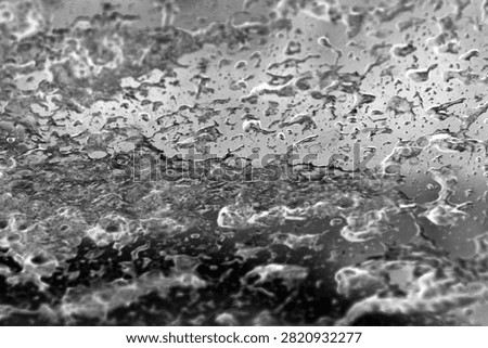 Backgrounds and Textures. Soap and Water splash and spread upon a glass window. Water on glass. Wet Background. Liquid Dreams. Water washes away dirt. Car Wash. Wet Window. Bubble Bath. Water on glass