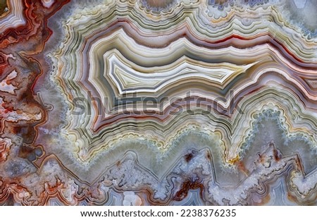 Backgrounds and textures: surface of beautiful decorative stone, abstract multicolor mineral pattern with cracks, spots and stains, natural background