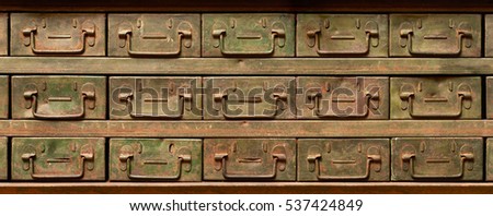 Backgrounds and textures: very old, rusty and worn, metal cabinet with drawers