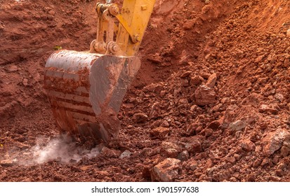 Backhoe Bucket Digging The Soil At Agriculture Farm To Make Pond. Crawler Excavator Digging At Shale Layer. Excavating Machine. Earth Moving Equipment. Excavation Vehicle. Construction Business.