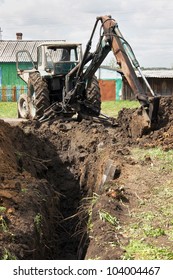 Backhoe Is Digging A Ditch