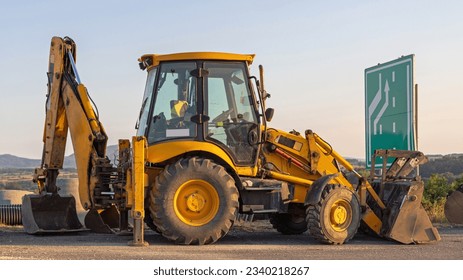 Backhoe Loader Machine at Highway Construction Site