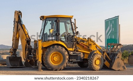 Backhoe Loader Machine at Highway Construction Site