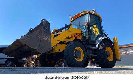 The backhoe loader is a type of road construction equipment.