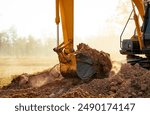 Backhoe working by digging soil at construction site. Crawler excavator digging on demolition site. Excavating machine. Earth moving machine. Excavation vehicle. Construction business.