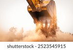 Backhoe working by digging soil at construction site bucket of crawler excavator breaking ground for new development project earth moving machine in action. Foundation work on construction project.