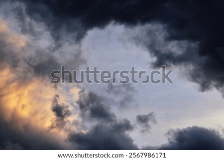 Backlighted stormclouds at sunset creating a window and 3D effect as seen from the Tasman tower in Groningen