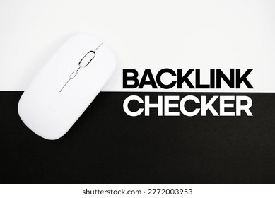 Backlink Checker text and wireless mouse on white and black background