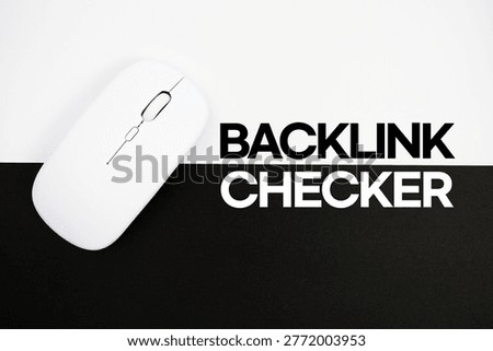 Backlink Checker text and wireless mouse on white and black background