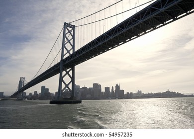 Backlit Bay Bridge Between San Francisco And Oakland California.