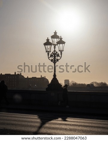 A backlit lamp post in the morning 